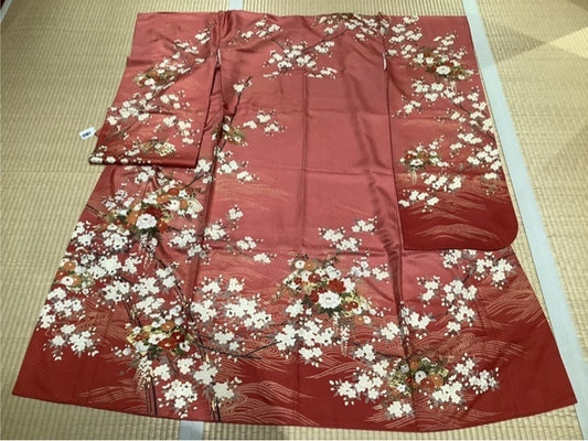 Furisode (long-sleeved kimono) in coral pink with cherry blossoms, peonies, chrysanthemums, and wisteria [5574181658169]