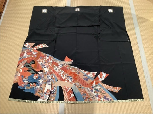 Black formal ceremonial ribbon with robin and crane design.