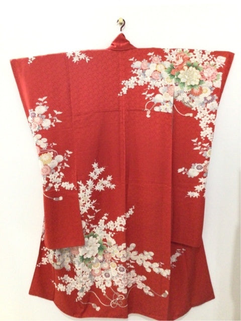 Furisode (long-sleeved kimono) in red with plum, chrysanthemum, and peony motifs. 4570191655717