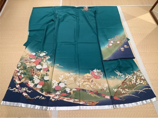 Furisode (long-sleeved kimono) in a blue-green to cream to navy gradient, featuring fan, chrysanthemum, and noshi (decorative paper wrapping) motifs. [4570191658268]