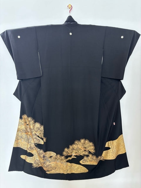 Black formal kimono with pine and branch motif, by a renowned artist, featuring embroidered komatsuna and gold and silver accents. [4570191712458]