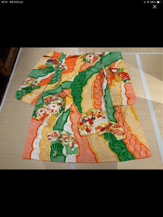 Furisode (long-sleeved kimono) in green, yellow, and orange, with a fan design [4570191653287]